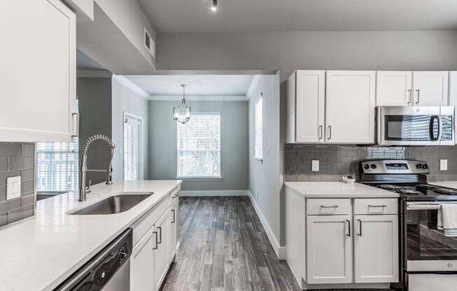 a large kitchen with stainless steel appliances