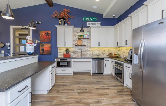 a large kitchen with stainless steel appliances