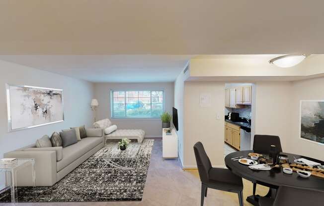 living area with sofa, coffee table, large windows, and views of kitchen and dining areas at cambridge square apartments in bethesda md