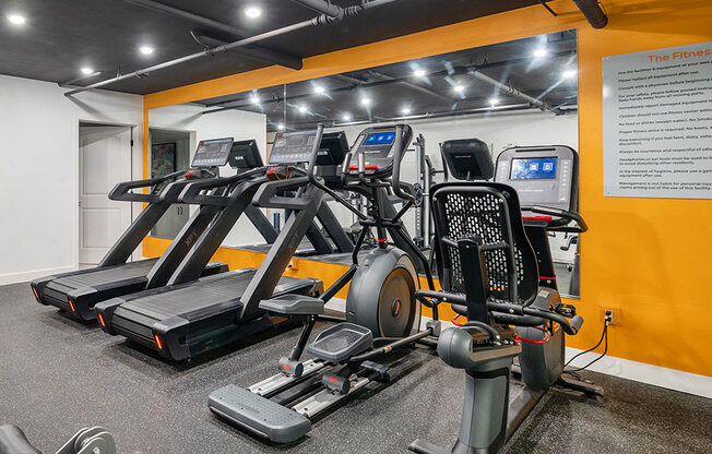 On-site fitness center with treadmills and weight machines.