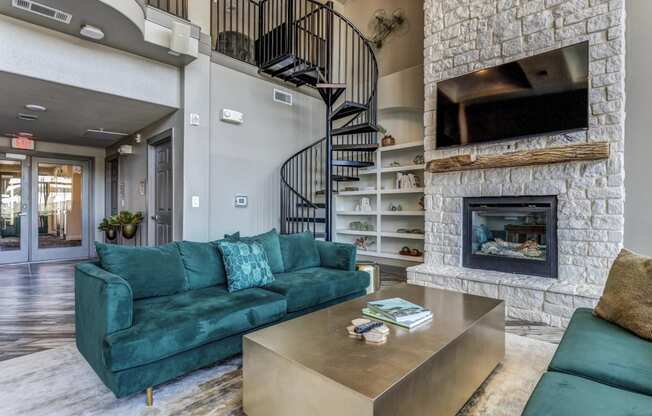 a fireplace with a tv above it and a couch and coffee table in front of it