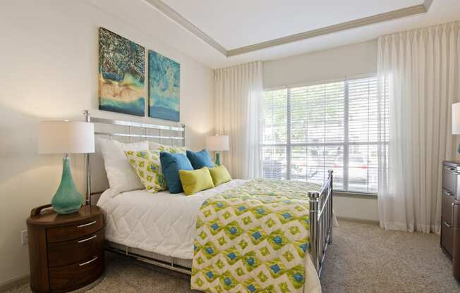 Bedroom in Model Apartment with Large Window located at St. Andrews Apartments in Johns Creek, GA 30022