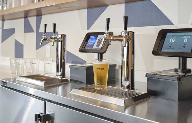 a glass of beer on a bar in a coffee shop