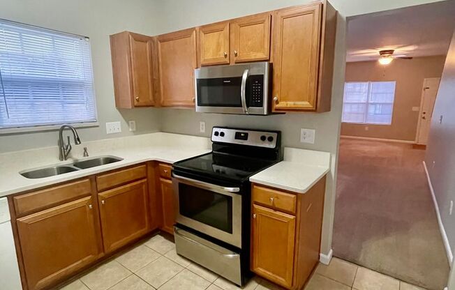 This two-story, 4-bedroom, 2-bath duplex in Fort Mill, SC sits on a corner lot