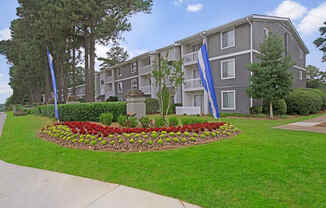 Exterior of Lacota Apartments, green landscaping and flowers