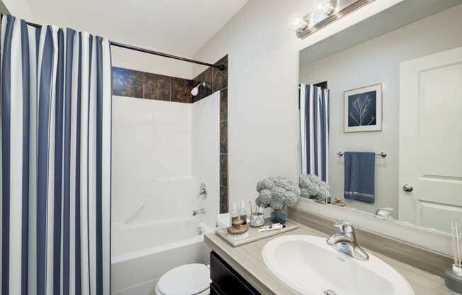 a bathroom with a shower and a sink and a mirror at Copper Pines, Bozeman, MT, 59718