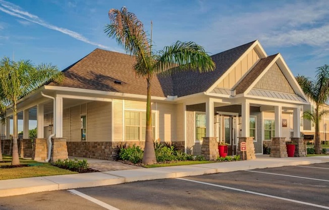A modern house with a brown roof and white walls is surrounded by a well-maintained lawn and palm trees at Mode at Melbourne, LLC Apartments, Florida, 32901
