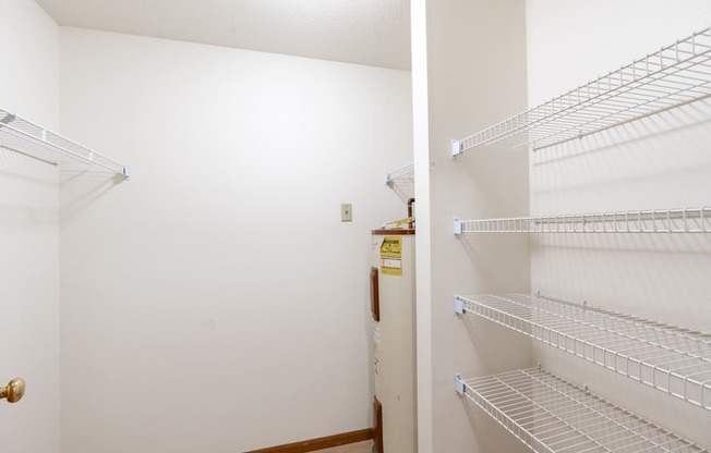 the closets in both bedrooms are closets with wire shelves. Fargo, ND Flagstone Apartments