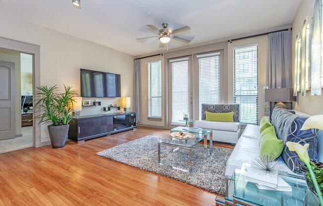 a living room filled with furniture and a large window