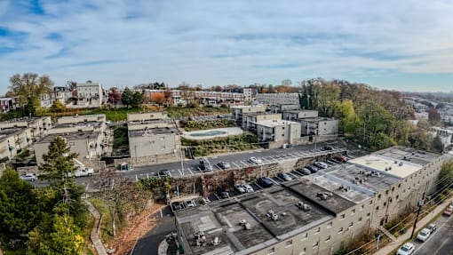 an aerial view of a city with buildings and trees