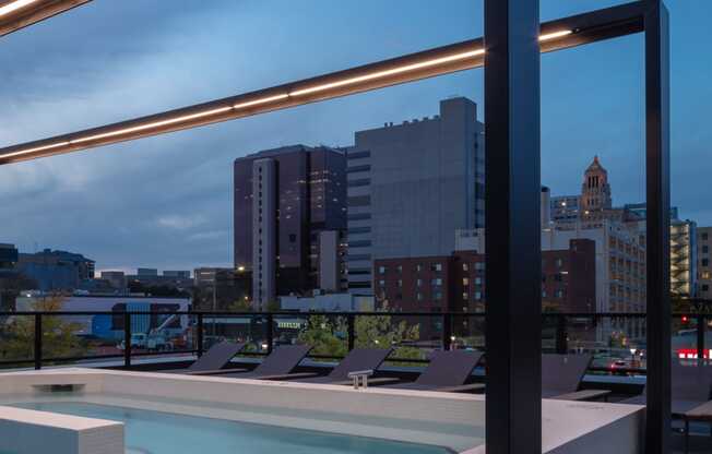 a view of the city from the rooftop of a building with a pool at Maven on Broadway, Rochester, MN