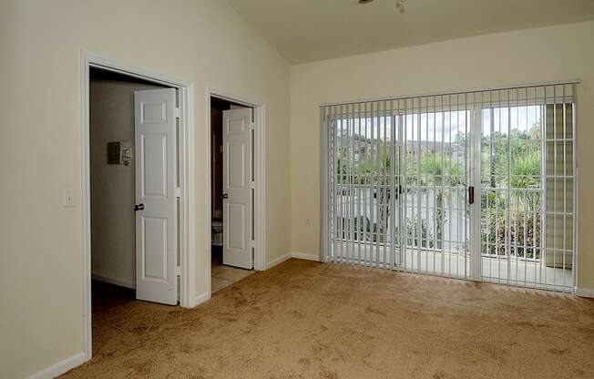 Interior Bedroom Sliding Glass at Magnolia Place Apartment, Gainesville
