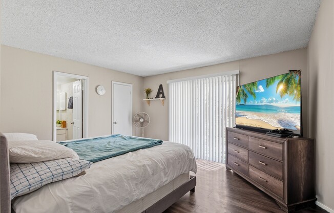 Welcome to Wymore 360 Apartments, where comfort meets style! This spacious bedroom features modern décor, natural light, and an inviting atmosphere. Relax and unwind in your personal retreat. Schedule your tour today to see it in person!