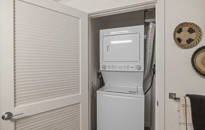 The Edge Milpitas CA a washer and dryer in the laundry room of a manufactured home