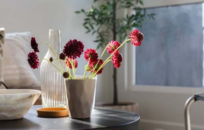 A table with a vase and a bowl on it at Skylar At Sunset Apartments, Los Angeles 90027