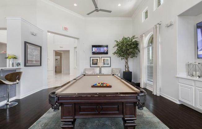 clubhouse with TVs and billiards table