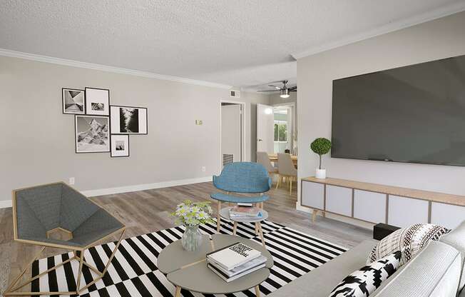 Hardwood floored living room with view of dining room.