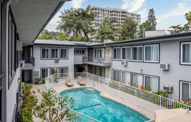 a view of the pool and pool house from the balcony