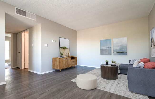 Renovated homes feature wood-style plank flooring at Acacia Gardens, Albuquerque