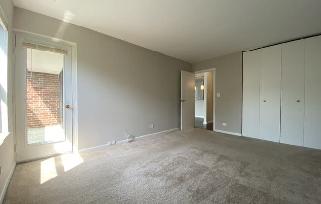 Large bedroom with balcony access