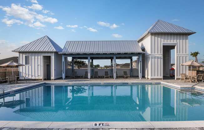 a house with a swimming pool in front of it