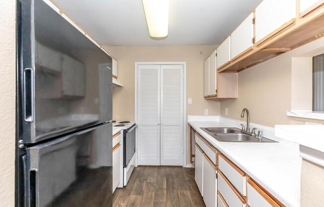 a kitchen with a sink and a window