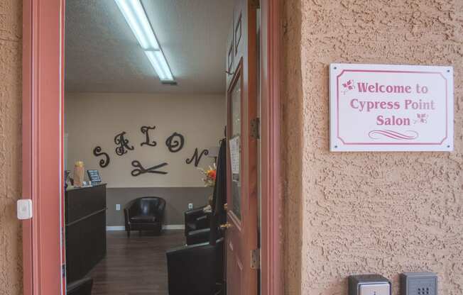 a sign that says welcome to cypress point salon