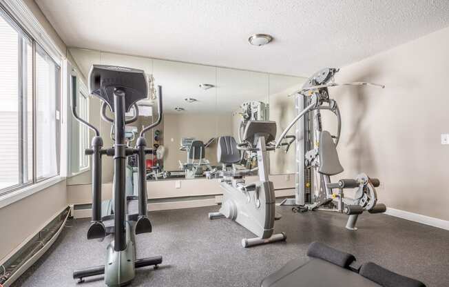 the gym at the enclave at woodbridge apartments in sugar land, tx