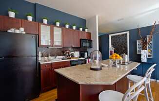a kitchen with a counter top and a refrigerator