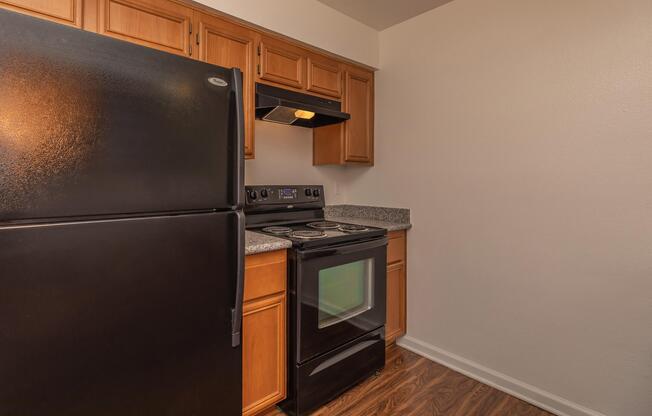 a kitchen with a stove top oven sitting inside of a refrigerator