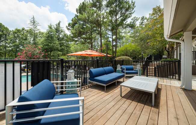 a patio with couches and a table