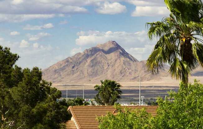 a view of a mountain and the ocean from a roof