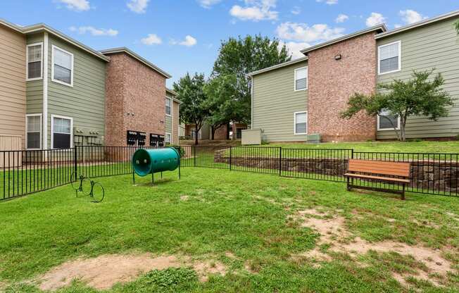 our apartments have a fenced in yard and a playground