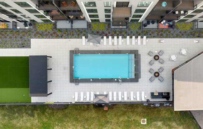 a birds eye view of the pool area of the hotel