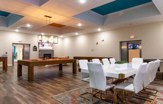 the preserve at ballantyne commons clubhouse with a pool table and dining room