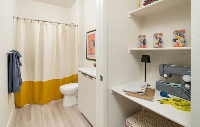 Built in desk and bathroom at Streamliner 16th Apartments in Phoenix