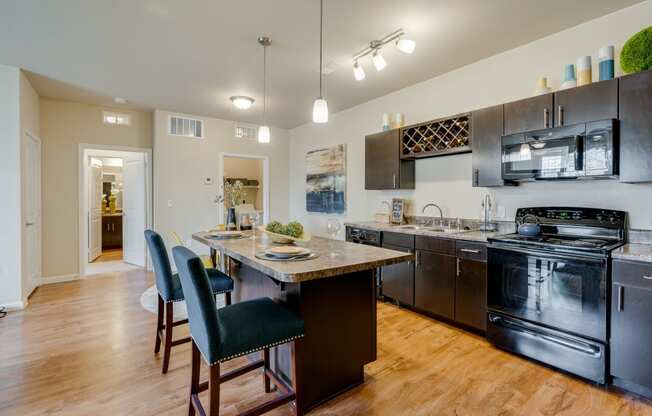 Spacious Kitchen With Bar Stool Seating At The Kitchen Island