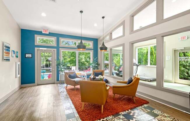Retreat at Indian Lake Hendersonville TN brightly lit leasing office with a blue wall and a red rug.