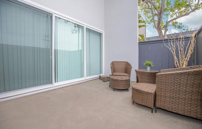 a living area with a building in the background