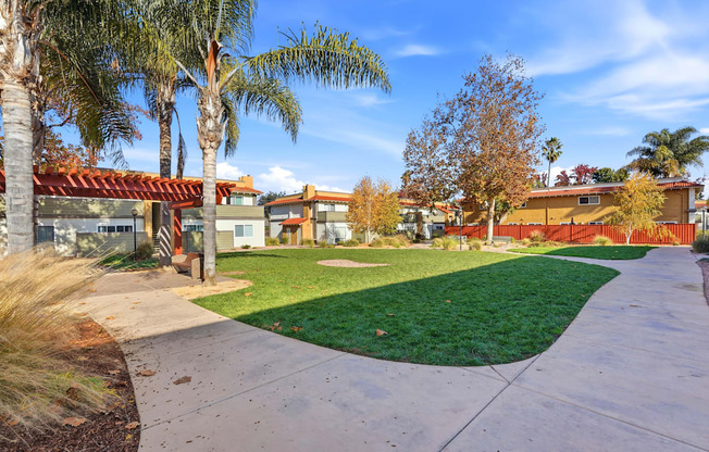 A residential area with houses and palm trees.