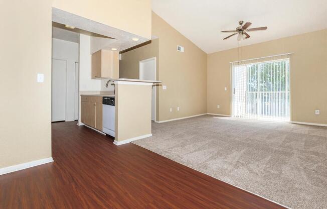 a large empty room with a wood floor
