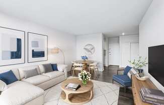 a living room with a white couch and a coffee table