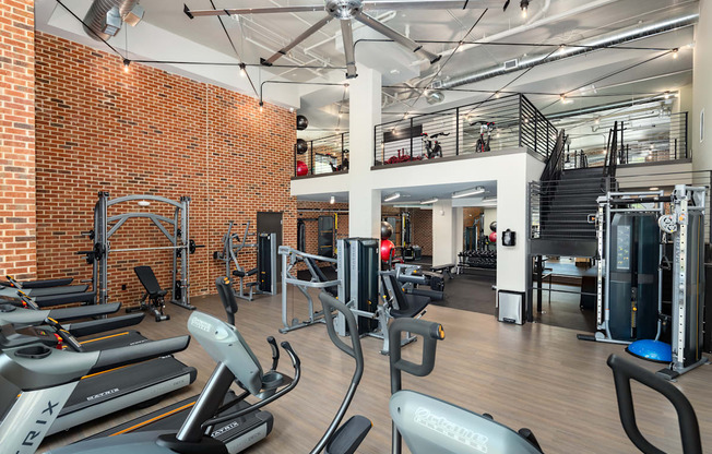 A gym with treadmills and exercise equipment.
