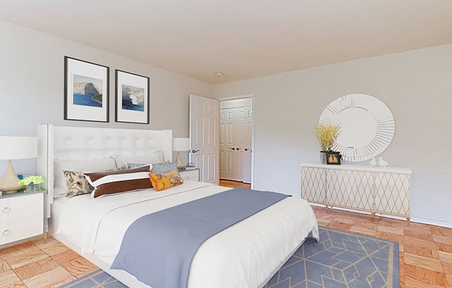 bedroom with bed, nightstands, dresser, mirror and hardwood flooring at fort totten apartments in washington dc