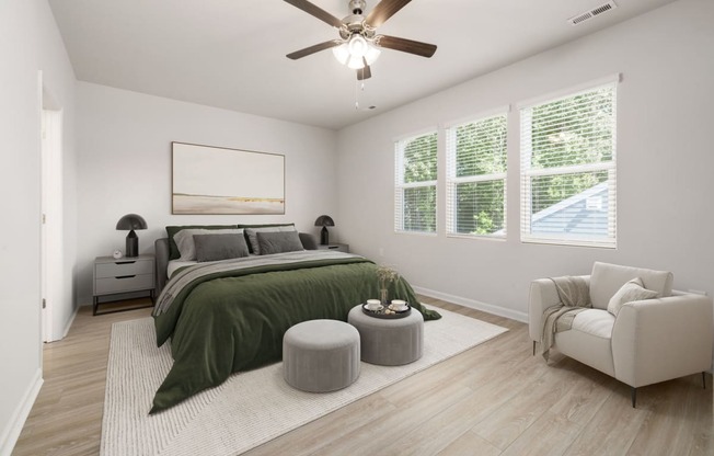 an open bedroom with a bed and a ceiling fan