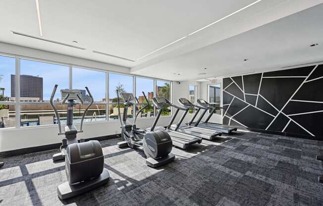 Our gym with treadmills and elliptical machines at Dominion Post Oak apartments in Houston, TX