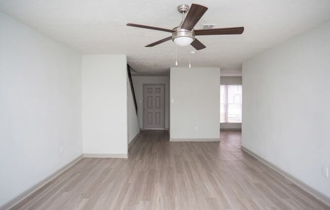 Living Room with ceiling fan and light at Gardens at Camp Creek, Georgia