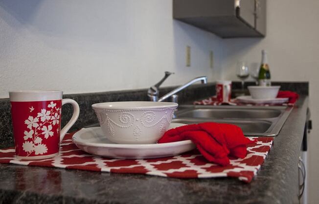 Sage Creek Apartments bowl with red towel decoration