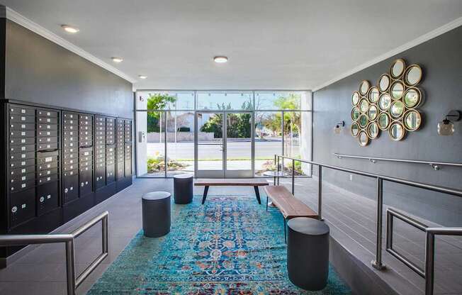A hallway with a blue rug and a wall hanging of plates.