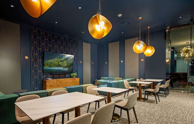 A conference room with a long table and chairs.